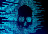 Cyber Scare Paralyzes Big Grocery Skull silhouette in blue computer code background.