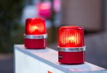 Plague Alarm Triggers Rapid U.S. Pivot red warning beacons on a barrier