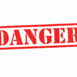 House Of Horrors: DA Drops Bombshell Red danger stamp on white background