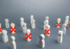 AI Bill Hits – Workers Panic Wooden figures with red X marks, signifying eliminated individuals.