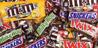 Assorted chocolate candy bars and M&M's in colorful wrappers