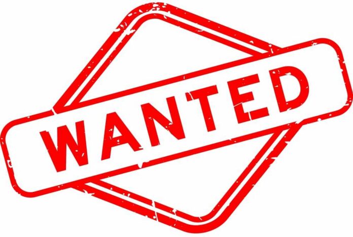 shutterstock_2072329448 Wanted stamp in red with distressed texture