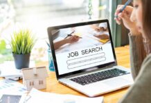 Jobs Shock: Hiring Hits The Brakes Person at desk viewing job search page on laptop