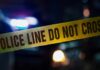 CHAOS: Kids Caught In Crossfire Police tape with blurred emergency lights in the background