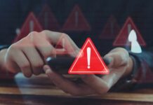 Person using smartphone with red warning icons overlay