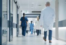 ALERT: Sick Kids Stranded Medical staff walking through a hospital corridor