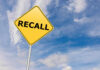 Amazon Medicine Recall Sparks Panic Yellow sign with RECALL text against blue sky.