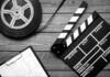 Big Screen Icon Dies Film reel, storyboard, and clapperboard on wooden surface.